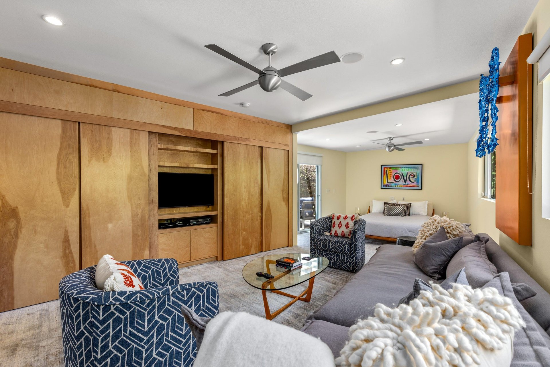 Features a queen size bed, own sitting area, smart TV, patio access, and ensuite bathroom.