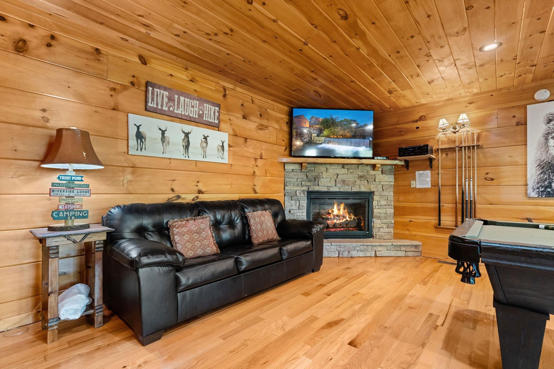 Sofa bed beside stone fireplace