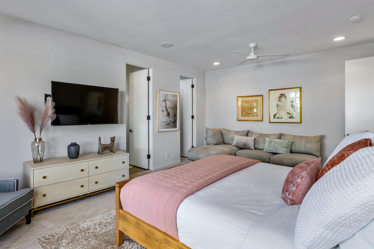 Guest bedroom with sofa seating area