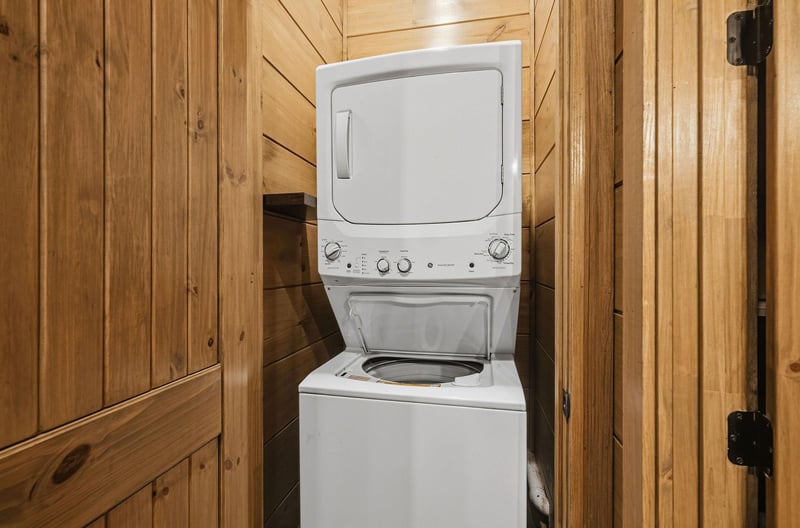 Your private laundry area keeps your clothes fresh throughout your stay in this cozy woodlined space.