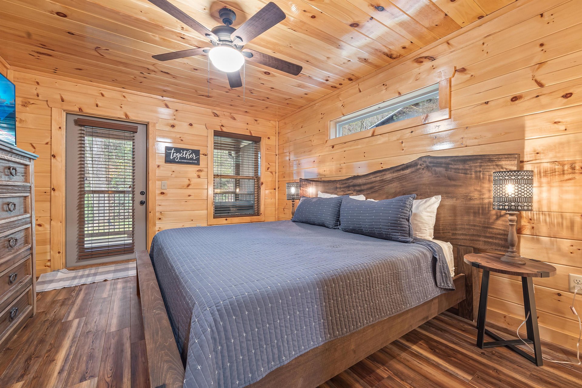King bed with window and door to deck