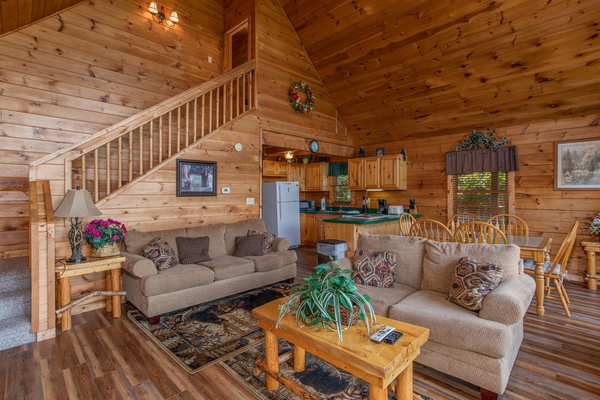 living room with sofa and love seat at angels majestic view a 3 bedroom cabin rental located in pigeon forge