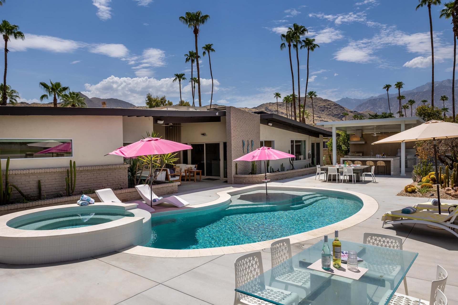 Private pool and spa overlooking the golf course. Additional features include outdoor kitchen, outdoor dining space, and a firepit.