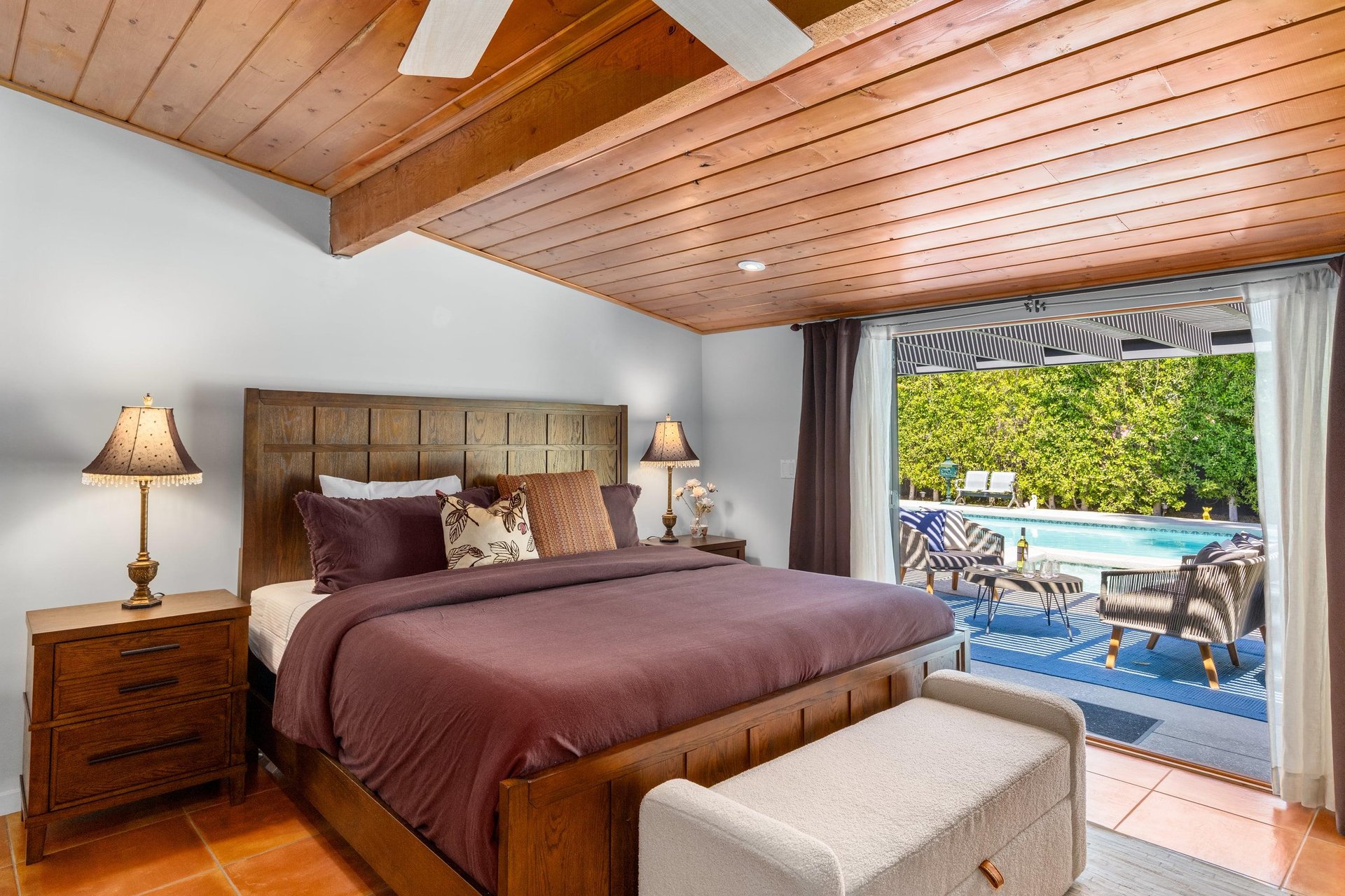King bed, smart TV, patio access, and ensuite bathroom.