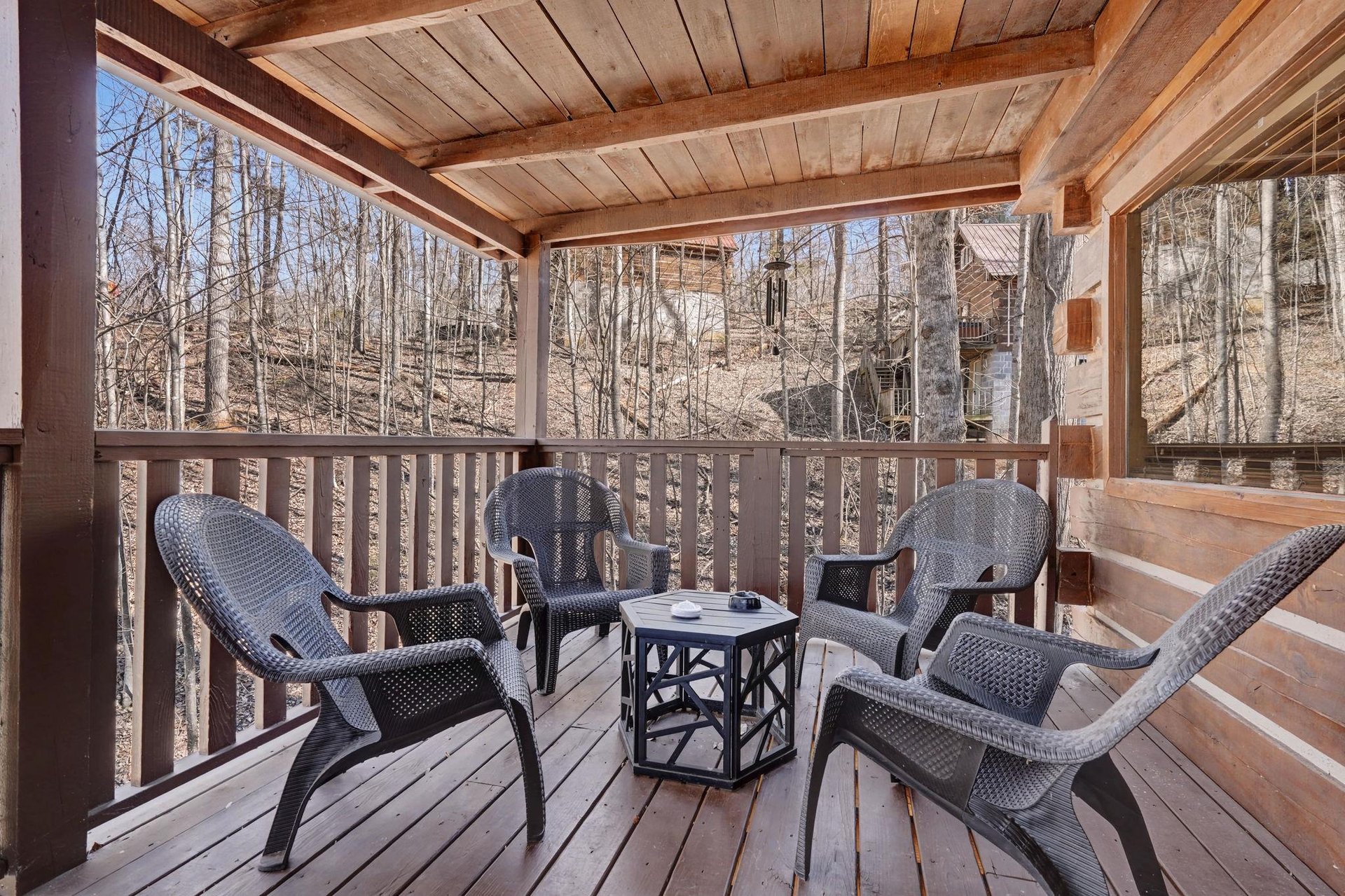 Relax in your private wooden balcony surrounded by peaceful forest views, perfect for morning coffee or evening conversations.