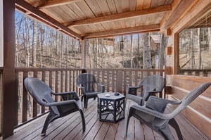 Relax in your private wooden balcony surrounded by peaceful forest views, perfect for morning coffee or evening conversations.