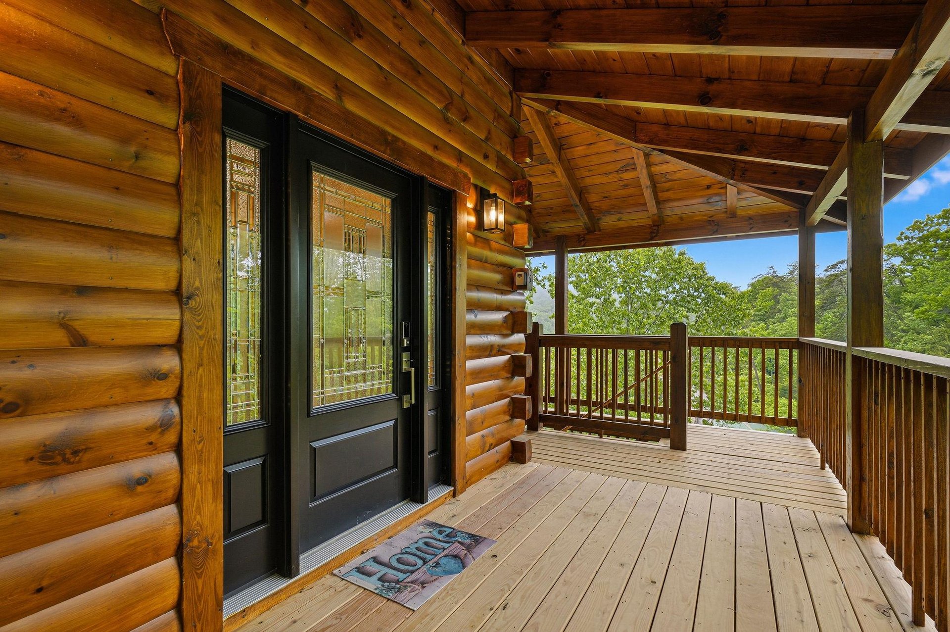 Step onto your private covered deck and breathe in the fresh mountain air while enjoying peaceful forest views.