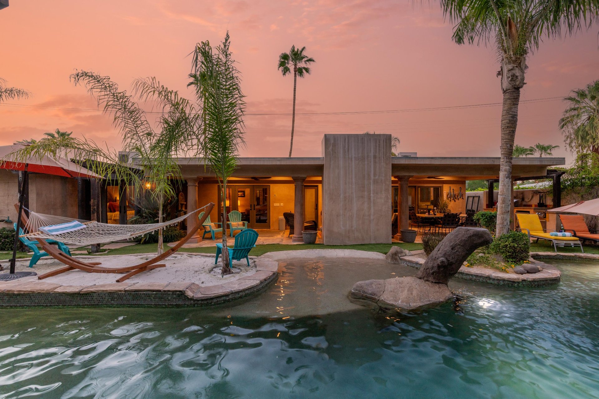 A lazy river, swim up bar, 2 grottos, waterslide, sandy beach, and hammock.