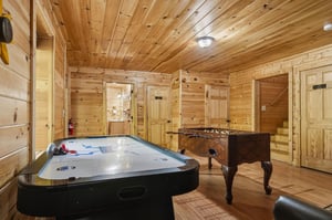 Your own private game room awaits with air hockey and foosball tables surrounded by warm wood walls.