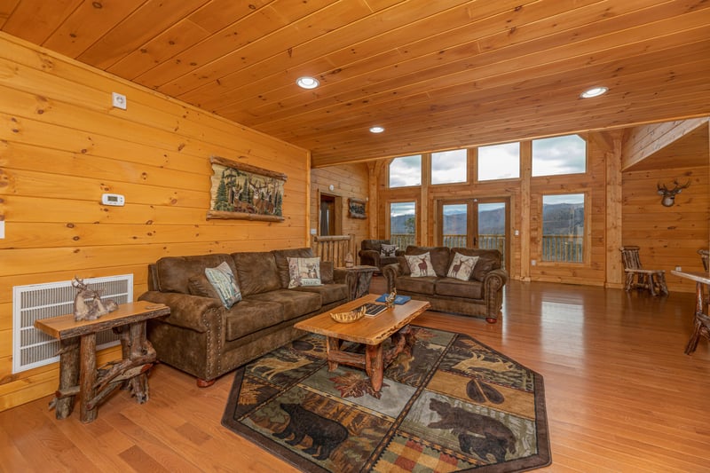 Sofa, loveseat, and coffee table at Js Hideaway, a 4 bedroom cabin rental located in Pigeon Forge