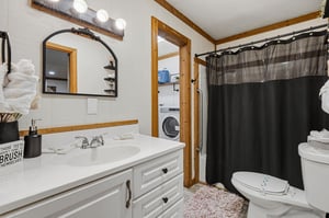 Your spacious bathroom features a vanity with storage, full showertub combo, and convenient inunit laundry facilities for maximum comfort.