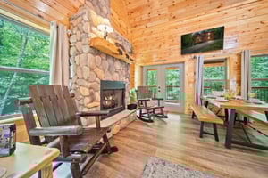 fireplace, dining, TV and balcony access