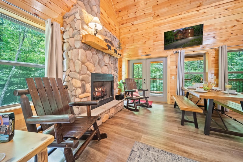 fireplace, dining, TV and balcony access