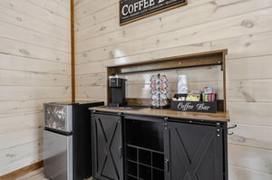 Start your mornings with a perfectly brewed cup from your private coffee bar, featuring a Keurig machine, Kcup selection, and rustic farmhouse charm.