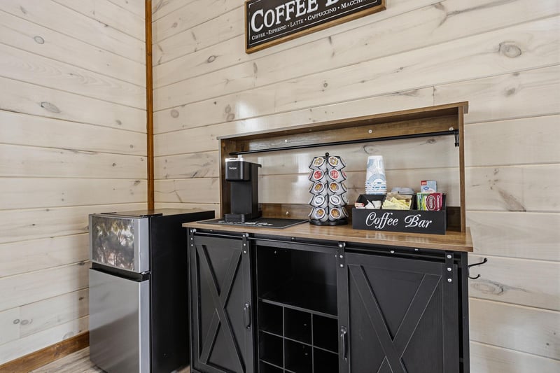 Start your mornings with a perfectly brewed cup from your private coffee bar, featuring a Keurig machine, Kcup selection, and rustic farmhouse charm.
