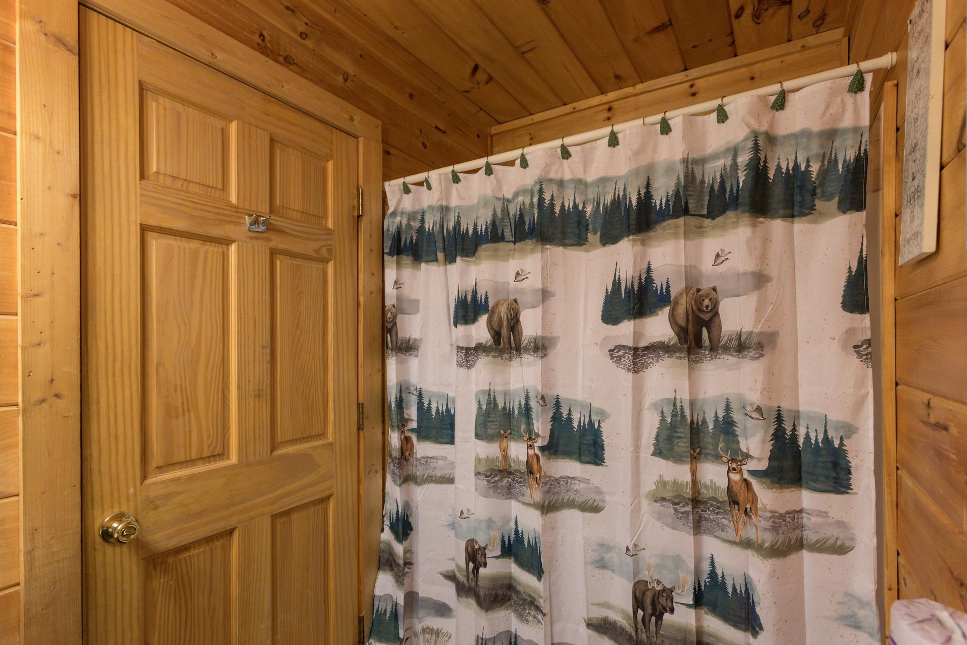 Bathroom with a tub and shower at Hibernation Station, a 3bedroom cabin rental located in Pigeon Forge