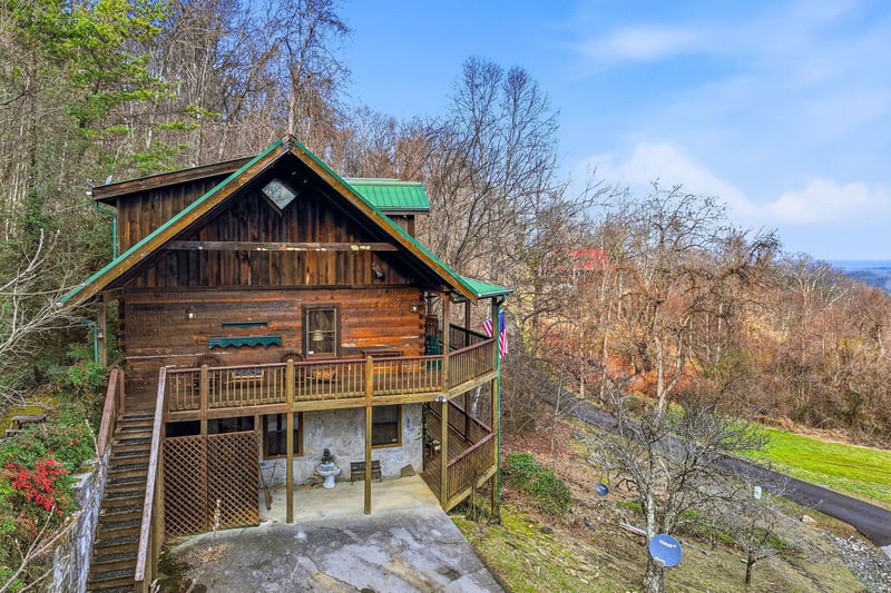 Rustic mountain cabin surrounded by vibrant autumn foliage and scenic Appalachian views.