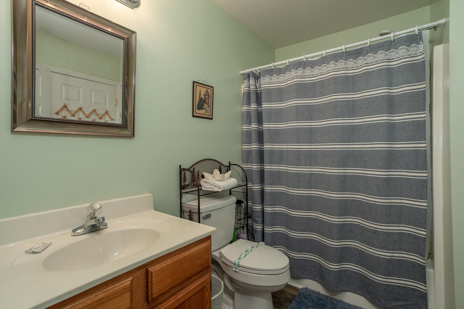 Bathroom with a tub and shower at Peace at the River, a 3 bedroom cabin rental located in Pigeon Forge
