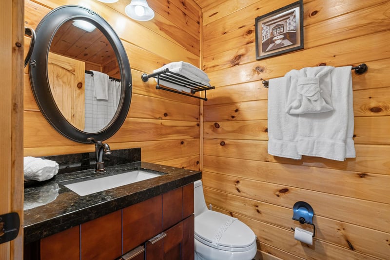 single vanity with round mirror