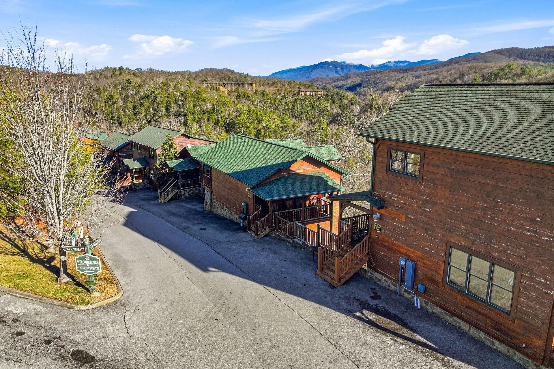 Mountain retreat with rustic cabins nestled among forested hills, offering peaceful escape with scenic valley views and abundant natural beauty.