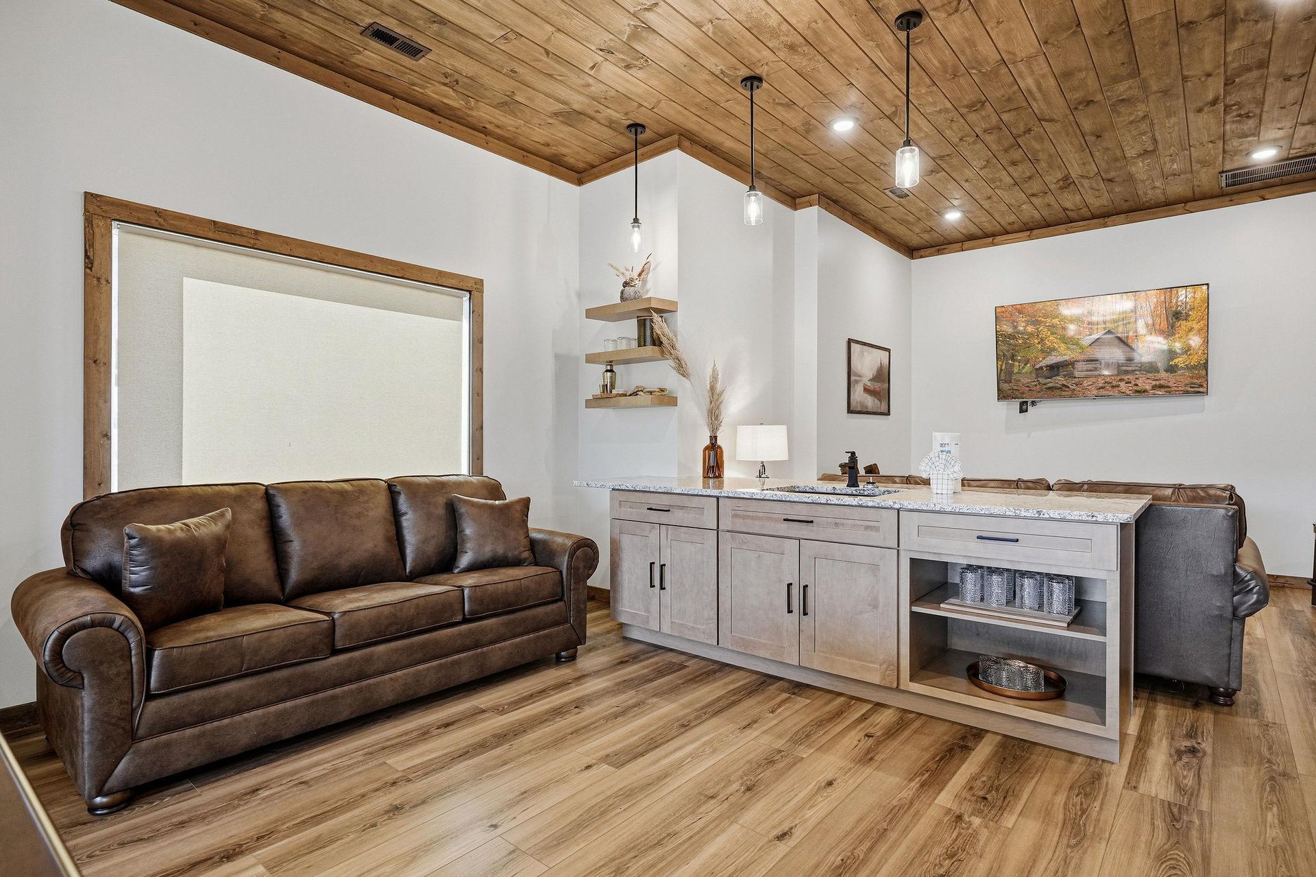 Your cozy retreat features rustic wood ceilings, leather seating, and a convenient kitchenette for relaxing evenings.