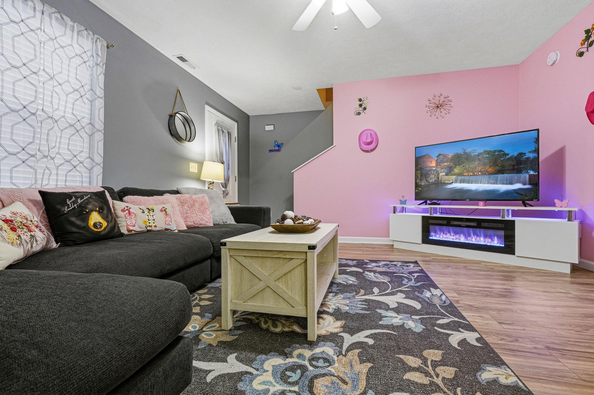 Settle into your cozy living room, where soft furnishings meet thoughtful touches—perfect for unwinding after a day of adventure.