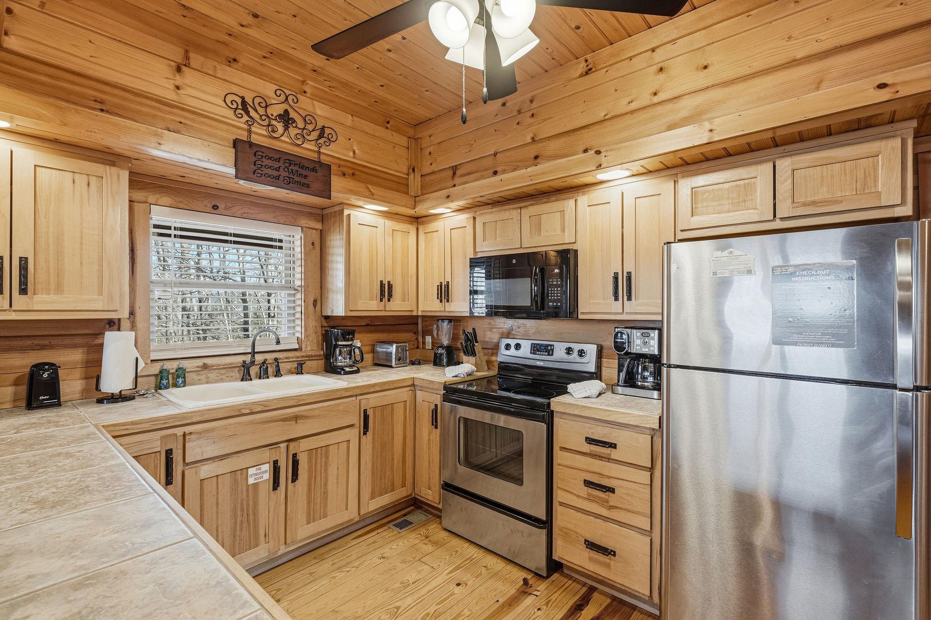 Your fully equipped kitchen features warm wood cabinetry, stainless steel appliances, and everything you need to create memorable meals together.