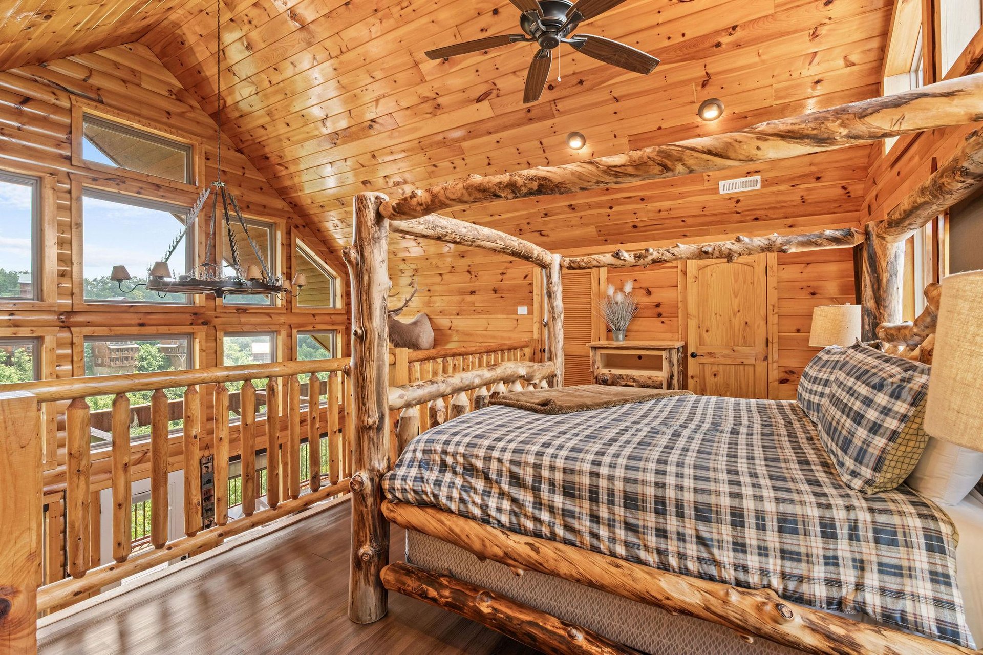 loft with canopy log king bed