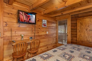 Writing desk and TV in a bedroom at A Lovers Secret, a 1 bedroom cabin rental located in Gatlinburg
