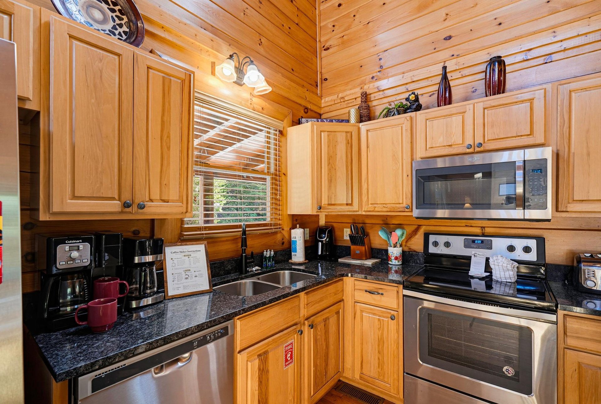 Your fullyequipped kitchen features stainless steel appliances, granite countertops, and everything you need to cook and gather over homecooked meals in your cozy cabin retreat.