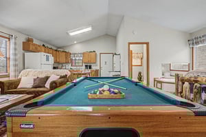 Challenge friends to billiards in your spacious game room, complete with comfortable seating and full kitchen for snacks.