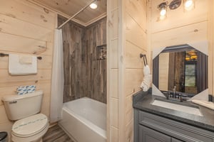 Full bath with bathtub with wood flooring walls
