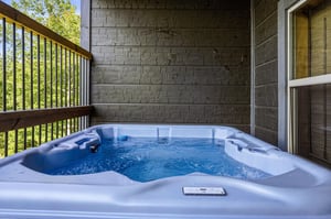 Step onto your private balcony and sink into the warm bubbling waters of your own hot tub, surrounded by lush greenery and the peaceful sounds of nature.