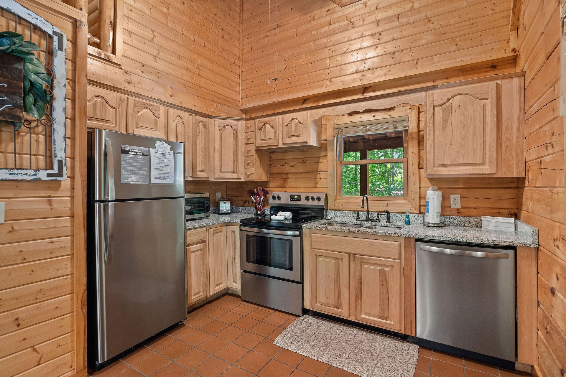 full size appliances and sink with window for natural light and view