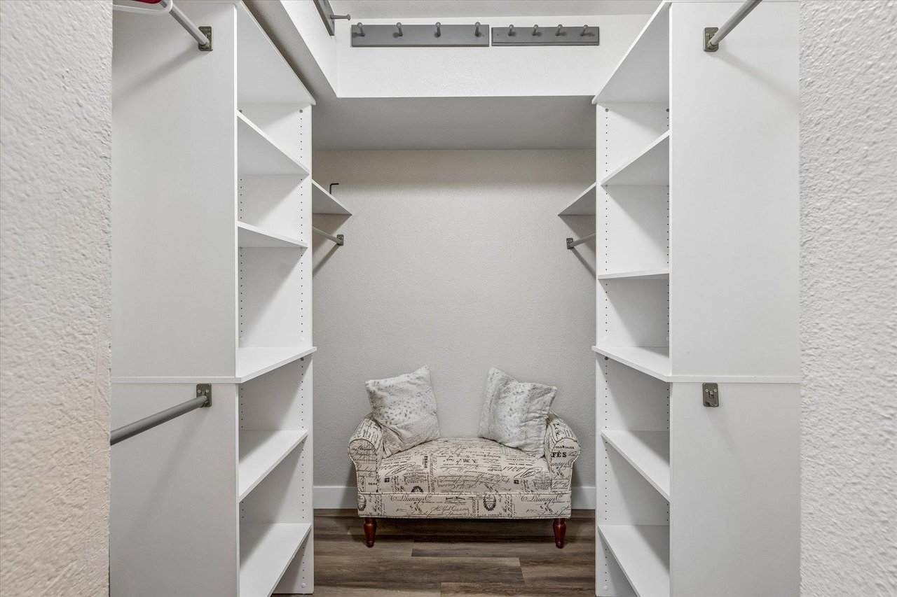 Walkin closet located in primary bedroom.