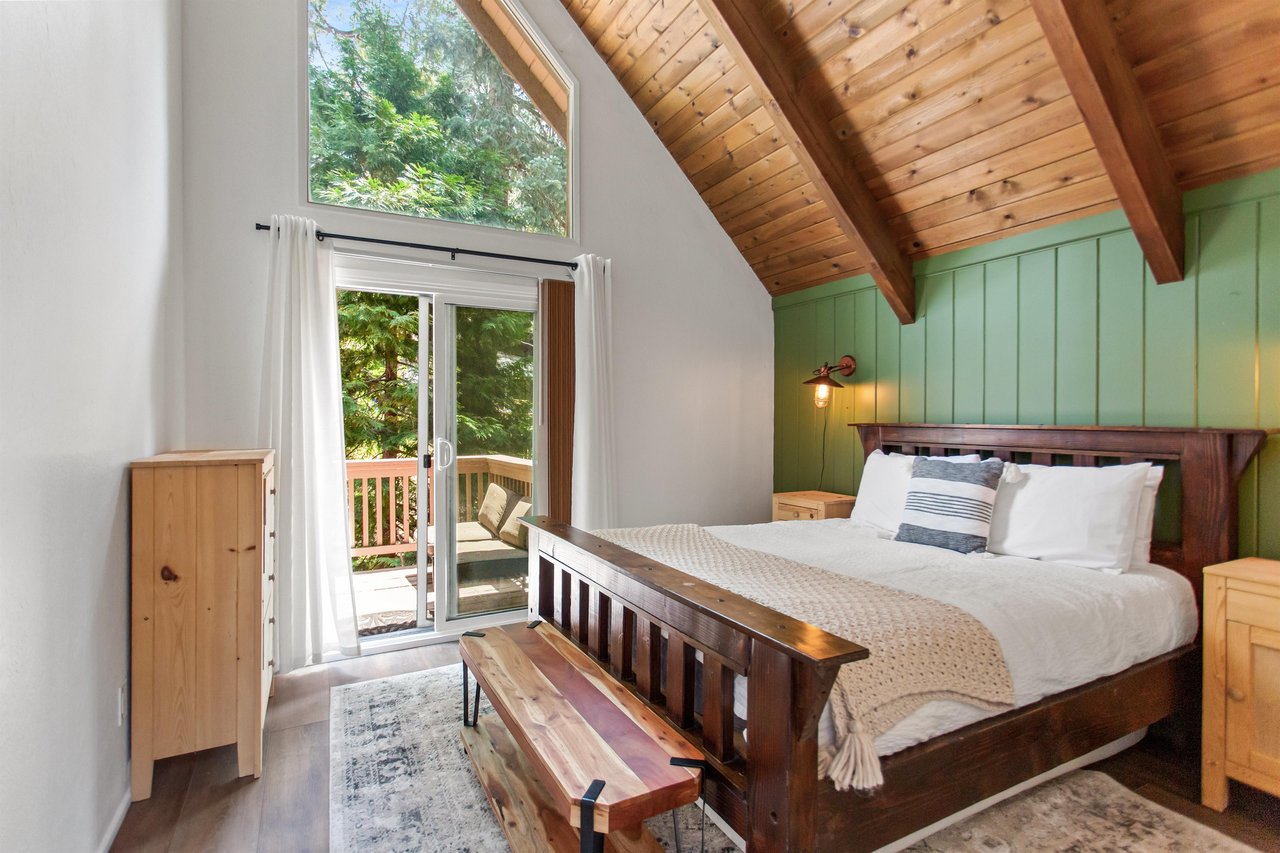 Queen size bed, and shared deck access.