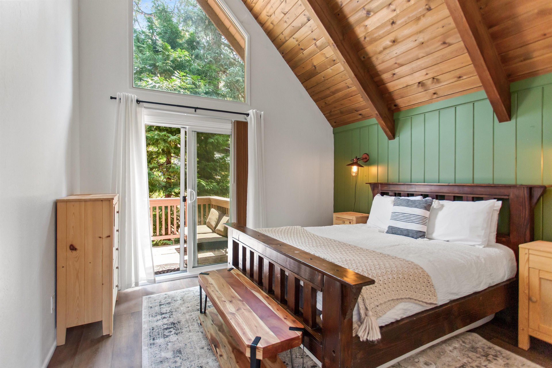 Queen size bed, and shared deck access.
