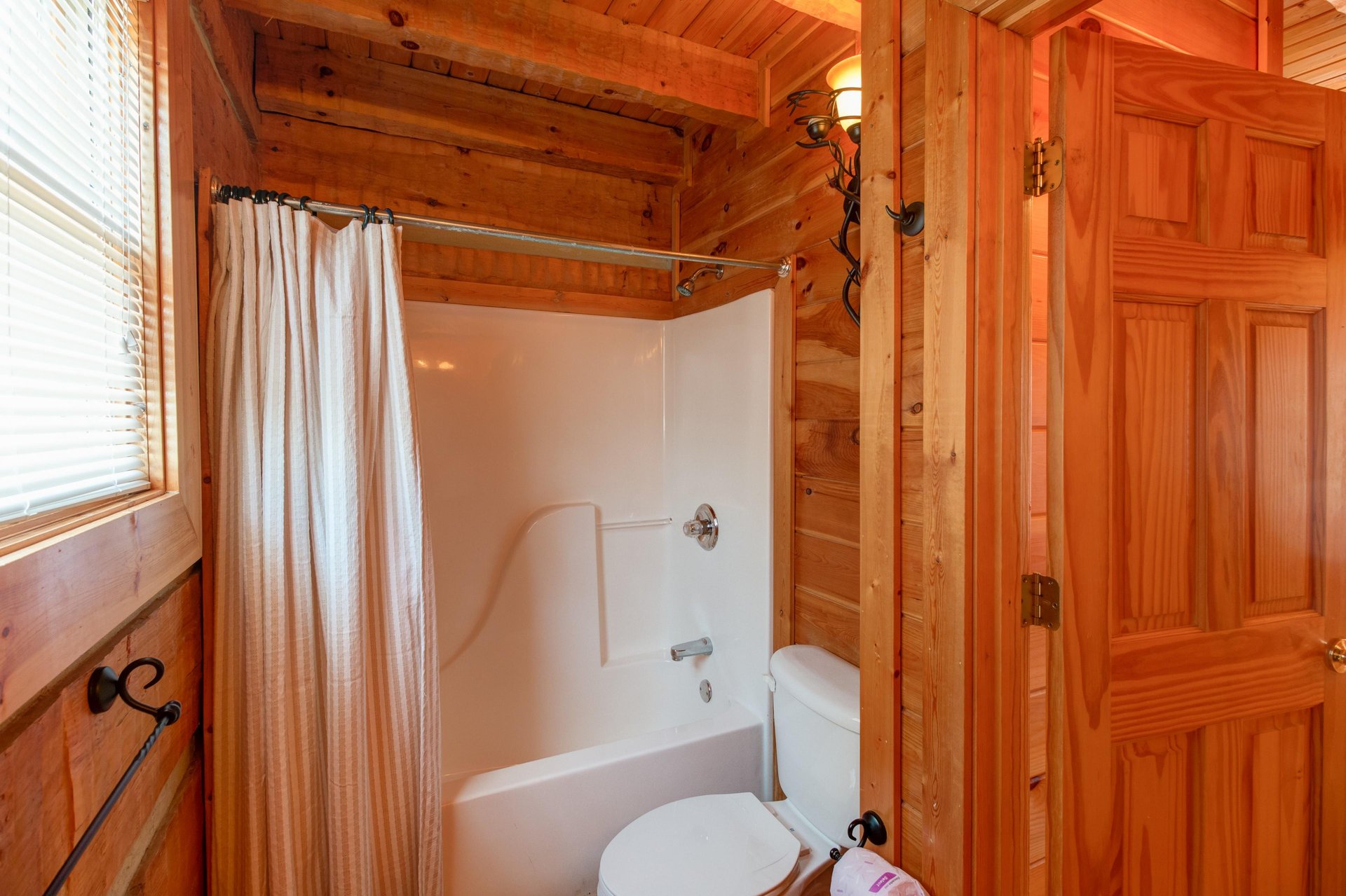 Bathroom with a tub and shower at EllaVation, a 3 bedroom cabin rental located in Gatlinburg