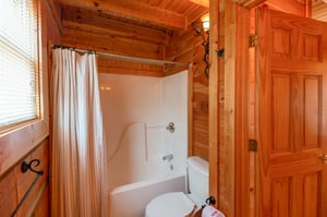 Bathroom with a tub and shower at EllaVation, a 3 bedroom cabin rental located in Gatlinburg