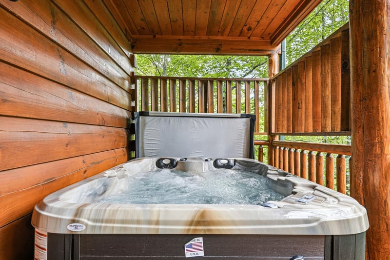 Soak away stress in your private hot tub, nestled on a covered deck surrounded by forest views and mountain air.