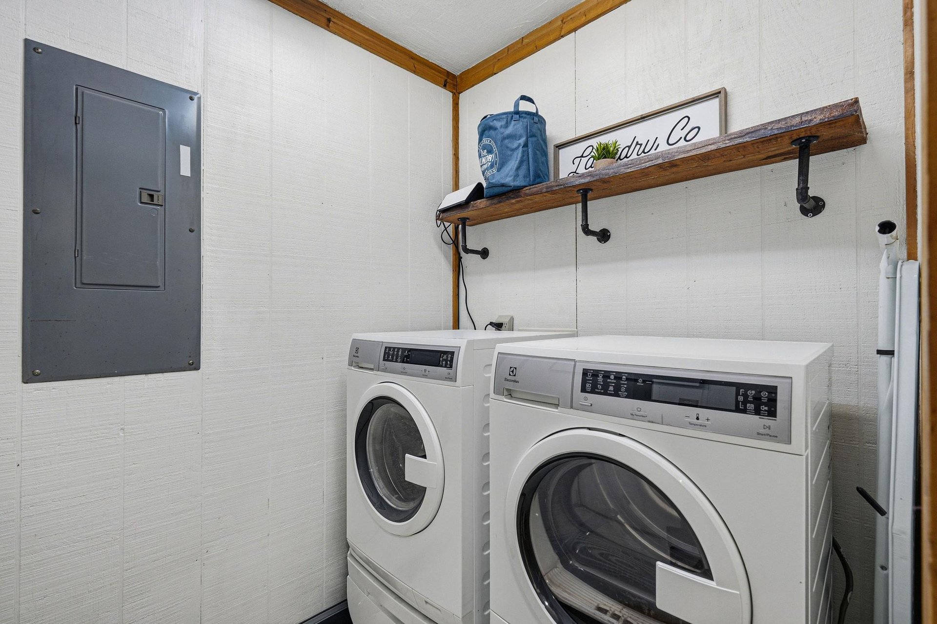 Keep your vacation wardrobe fresh with this convenient laundry space featuring fullsized washer and dryer, plus handy storage shelf.