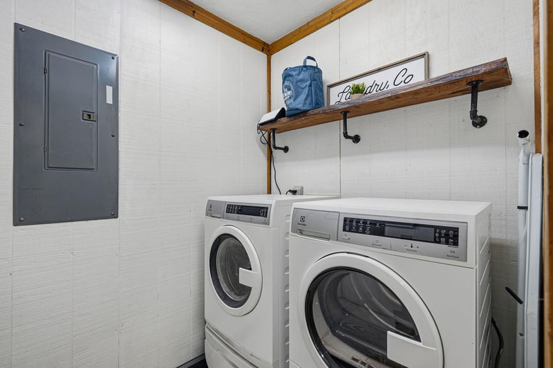 Keep your vacation wardrobe fresh with this convenient laundry space featuring fullsized washer and dryer, plus handy storage shelf.