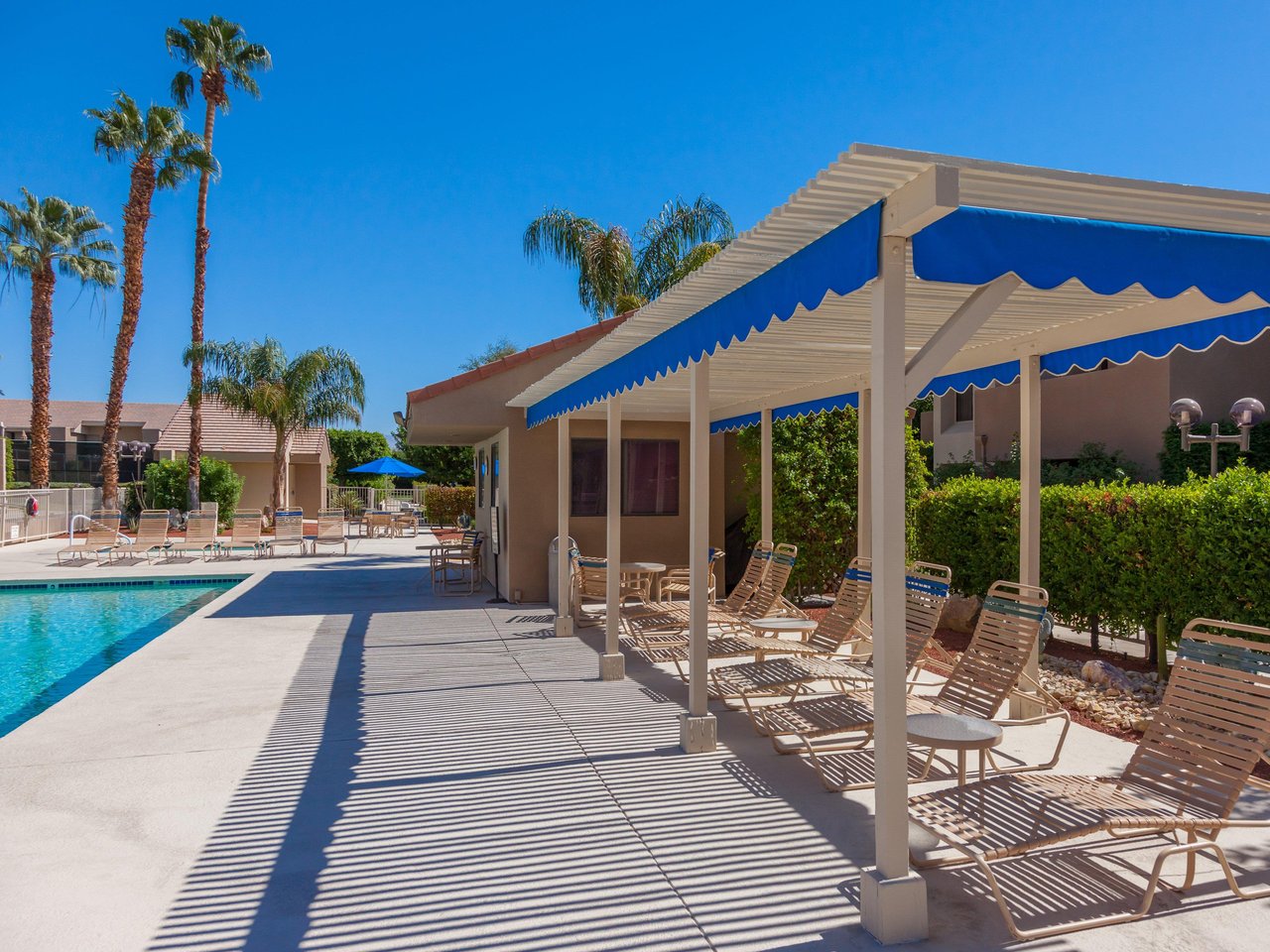 Covered poolside lounge chairs