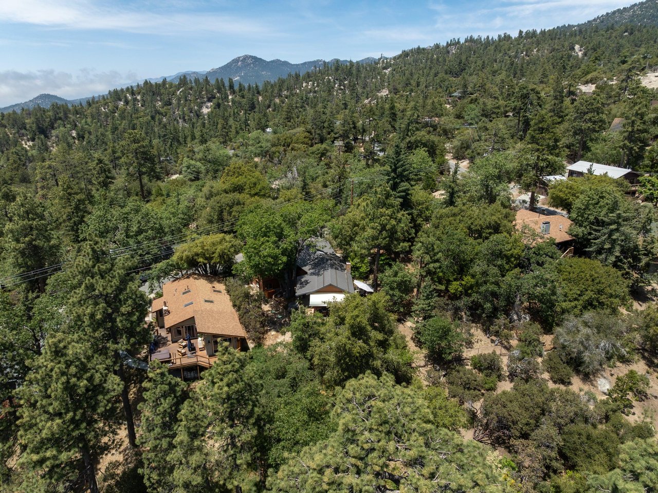Nestled in the trees, mountain views.