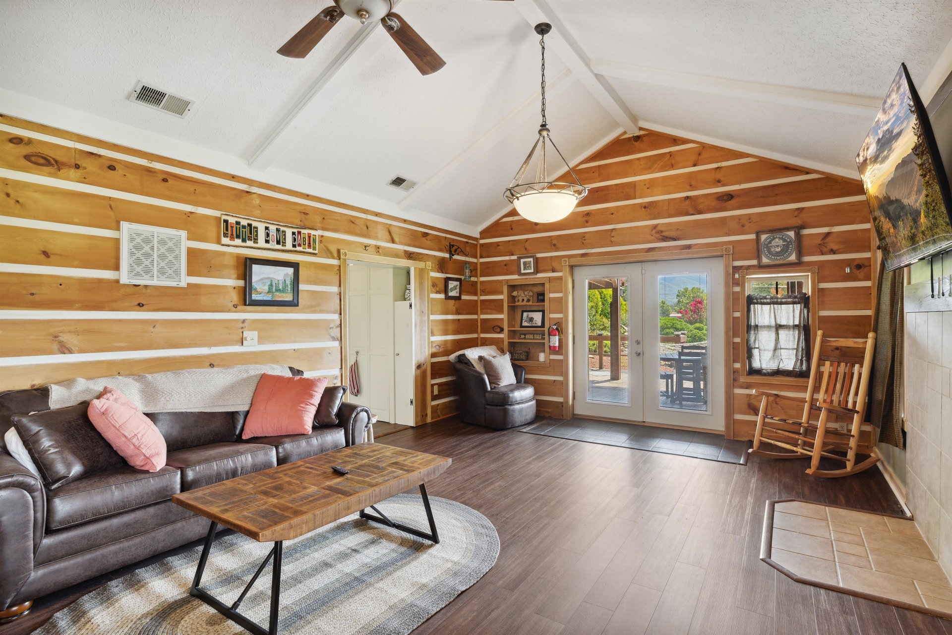 living room with sofa bed and balcony access