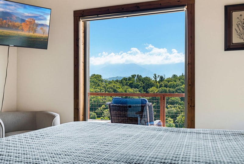 Wake up to mountain vistas and lush greenery from your private balcony. This cozy bedroom invites you to sip your morning coffee while soaking in panoramic views.