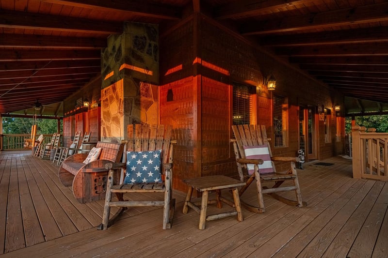 Gather on the wraparound porch with rustic rocking chairs and charming wooden details, perfect for unwinding after a day of adventure.