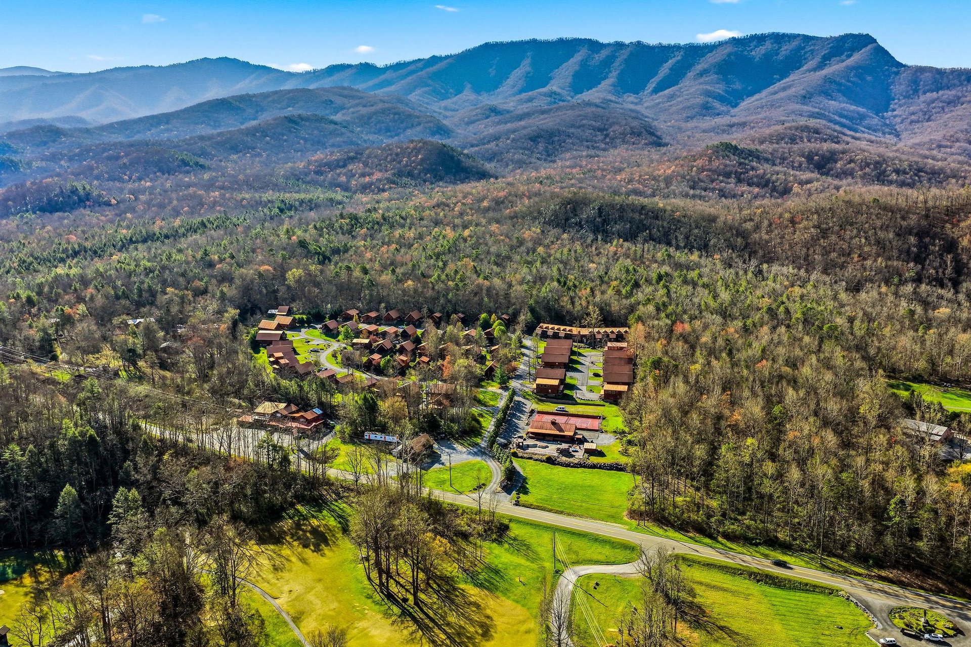 Mountain resort nestled in scenic Appalachian foothills, surrounded by rolling peaks and pristine forest landscape.