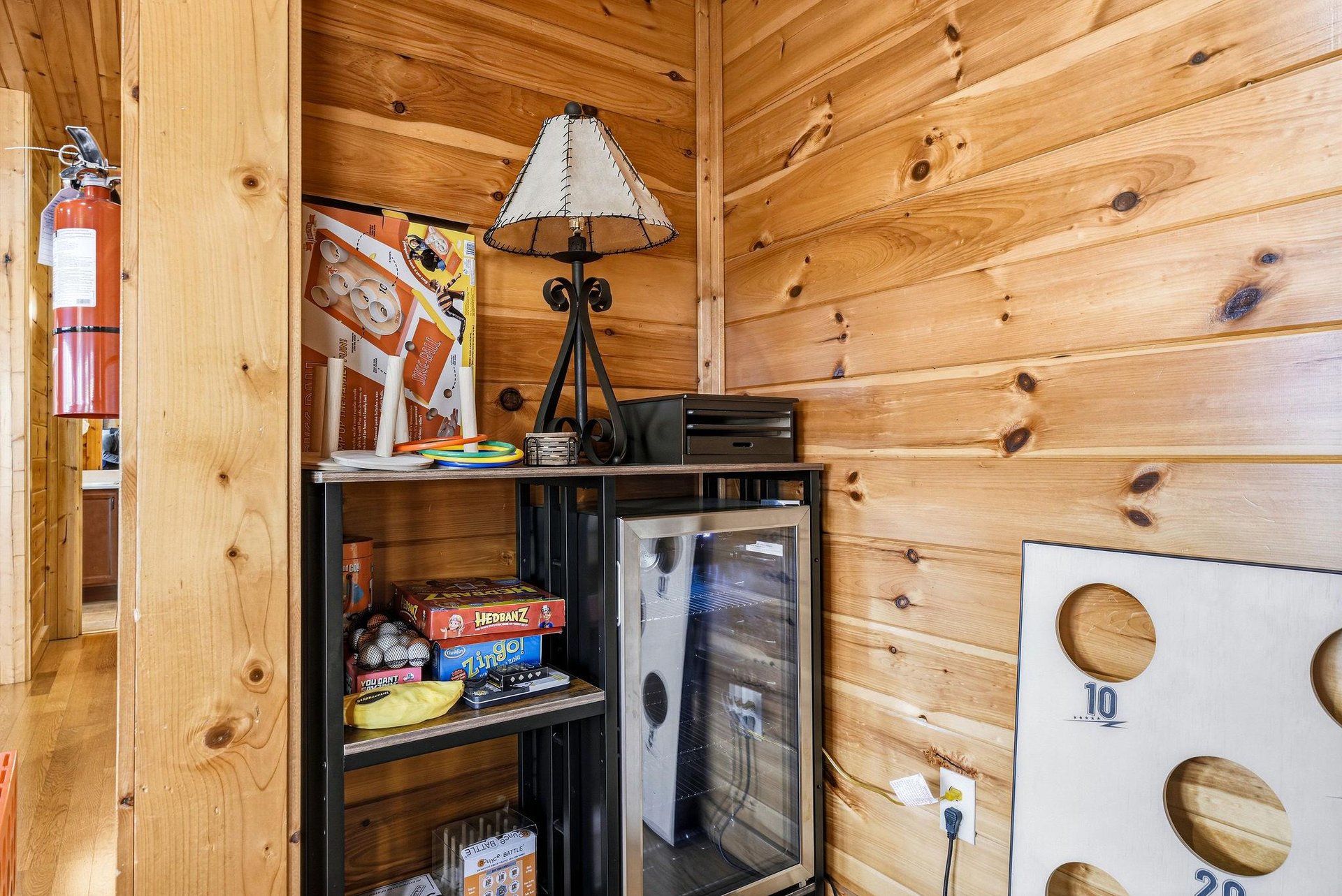 Your cozy corner features rustic cabin charm with games, snacks, and entertainment ready for memorable evenings together.
