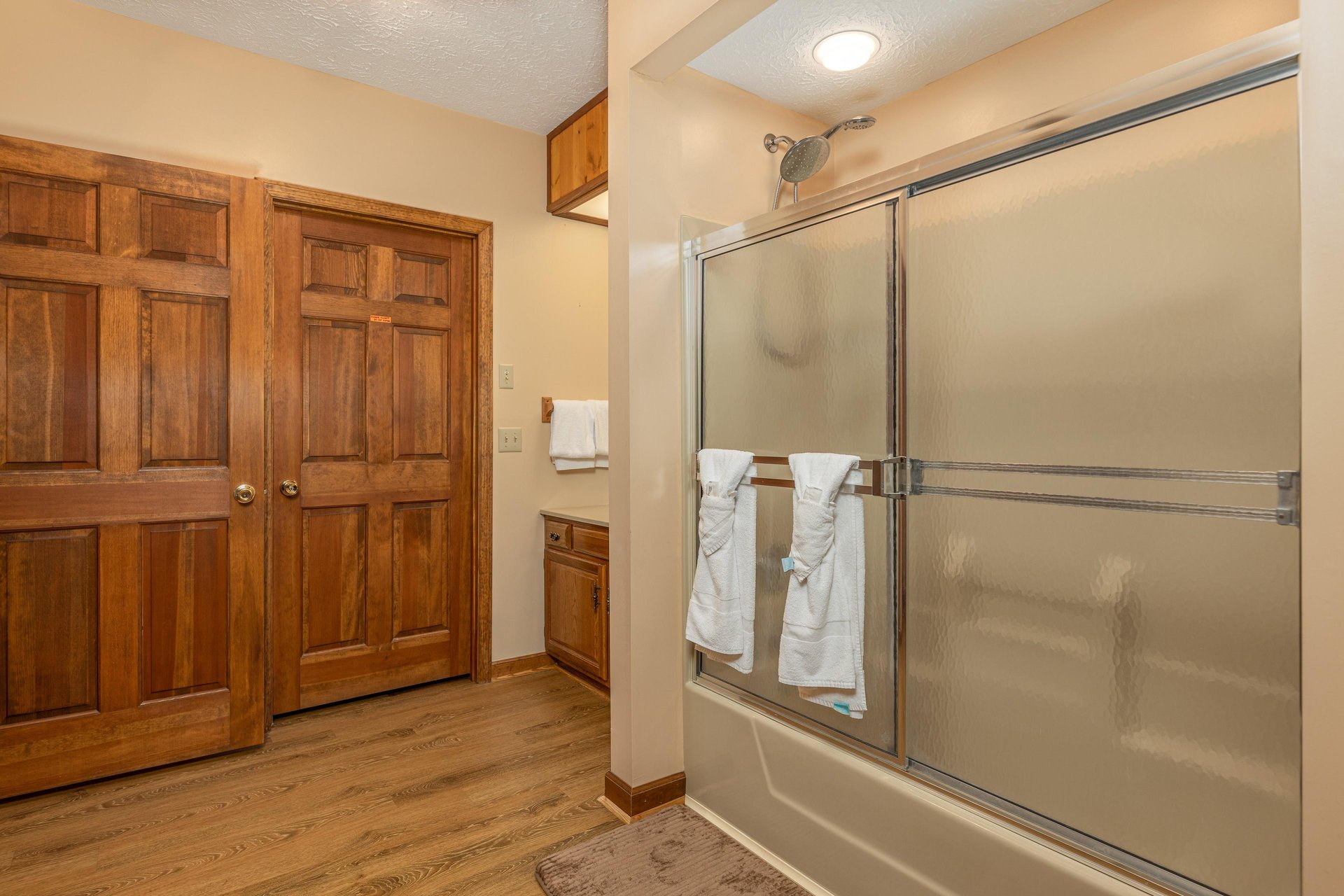 Bathroom with a tub and shower at Cubs Crib, a 3 bedroom cabin rental located in Gatlinburg